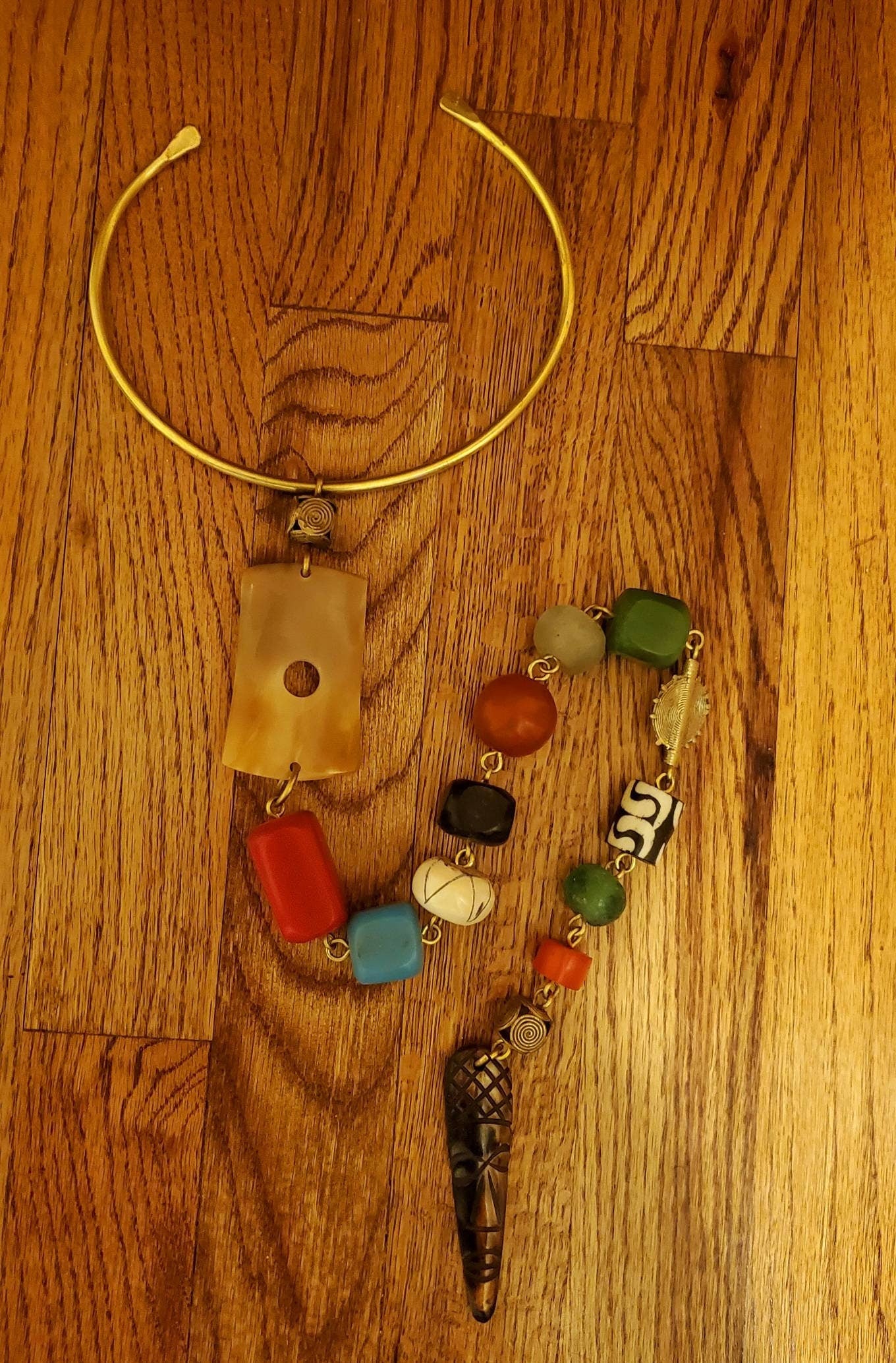 African Inspired long Batik Bone/Horn chunky beaded necklace. Length is from 19 to 22 inches.