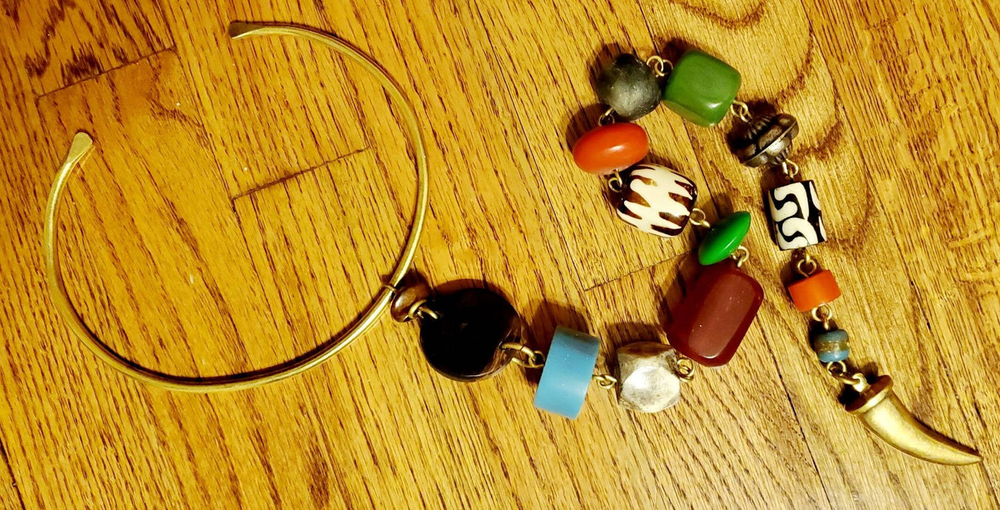 African Inspired long Batik Bone/Horn chunky beaded necklace. Length is from 19 to 22 inches.