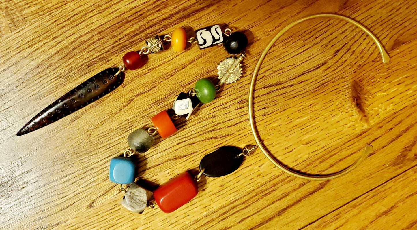 African Inspired long Batik Bone/Horn chunky beaded necklace. Length is from 19 to 22 inches.