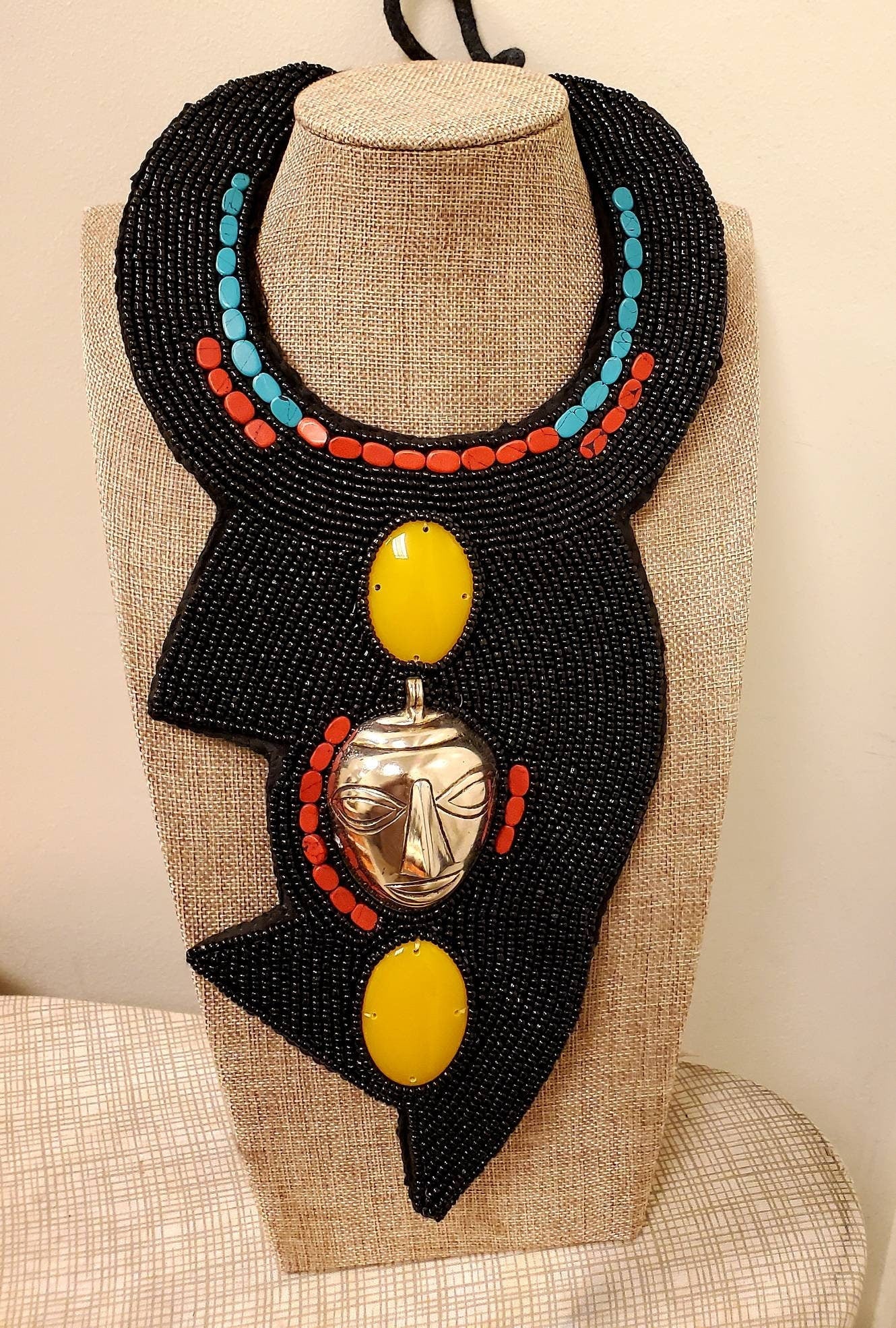 African Bibb Necklace with a mask. 10 inches.