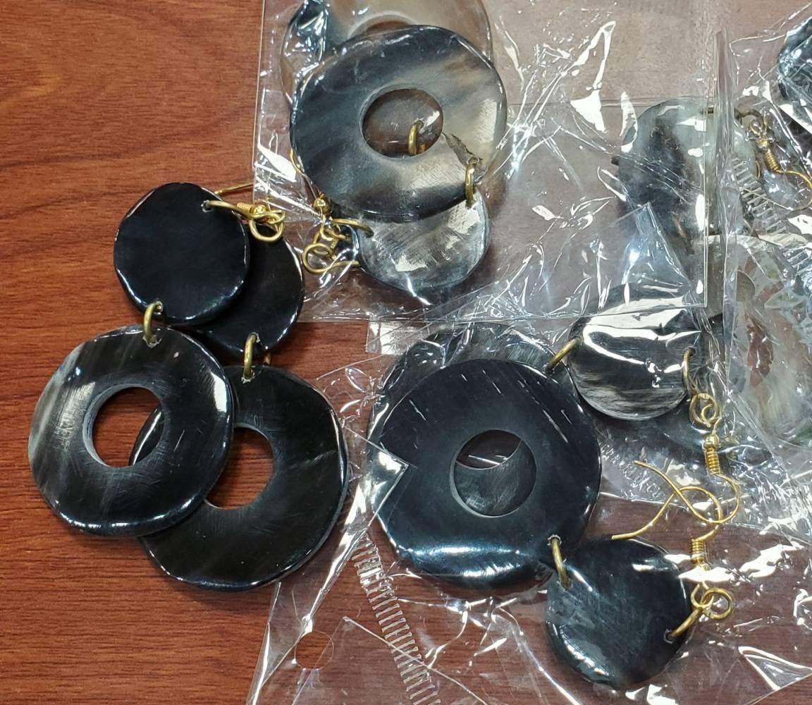 Round Dangling Cowhorn Earrings.
