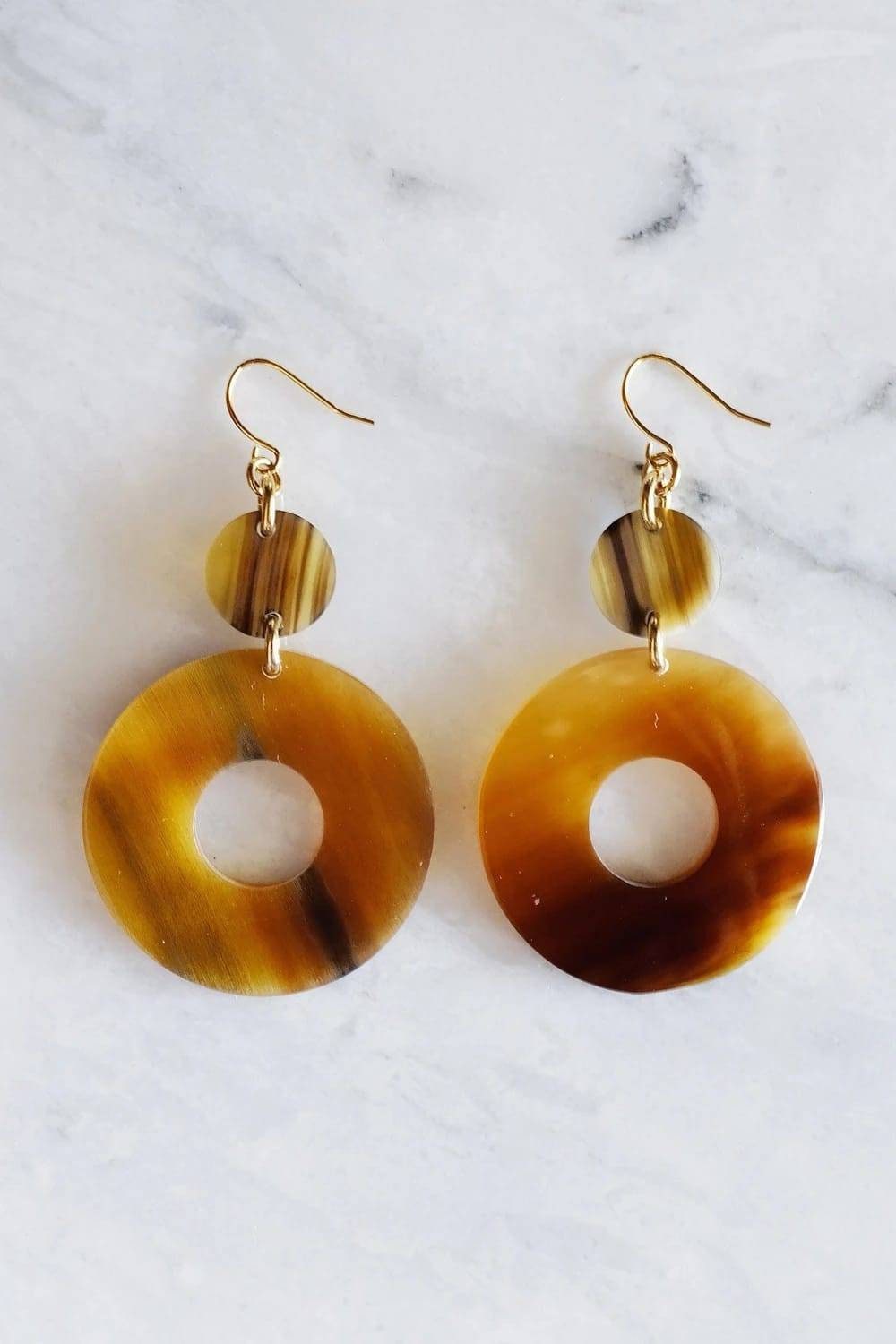 Round Dangling Cowhorn Earrings.