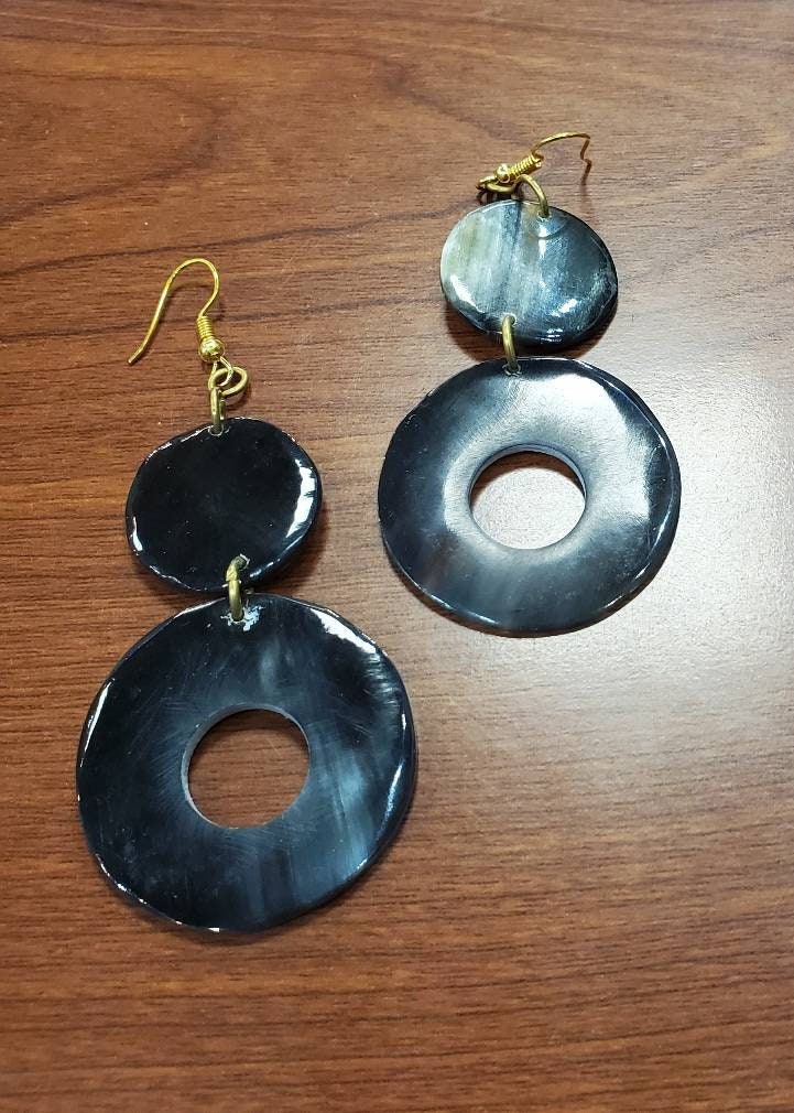 Round Dangling Cowhorn Earrings.