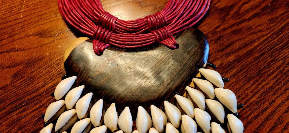 Huge V Cowrie on Ebony Wood Necklace. Length 12 inches.