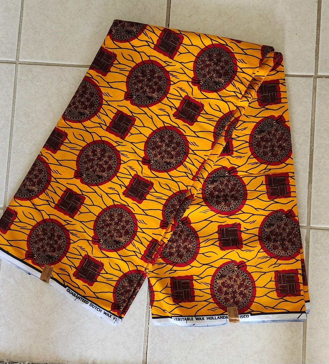 African Print Burgundy and Gold 100% Cotton/sold per yd or 6 yards.