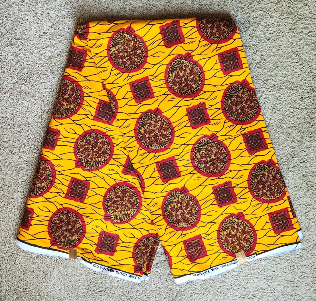 African Print Burgundy and Gold 100% Cotton/sold per yd or 6 yards.