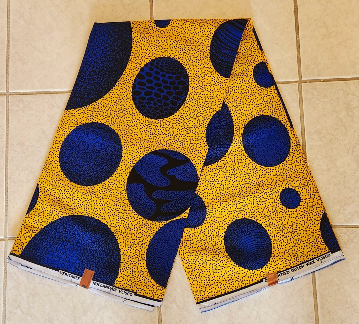 African Print Ankara featuring Multicolor Blue Polka dot in yellow . Sold by yard/6 Yards.