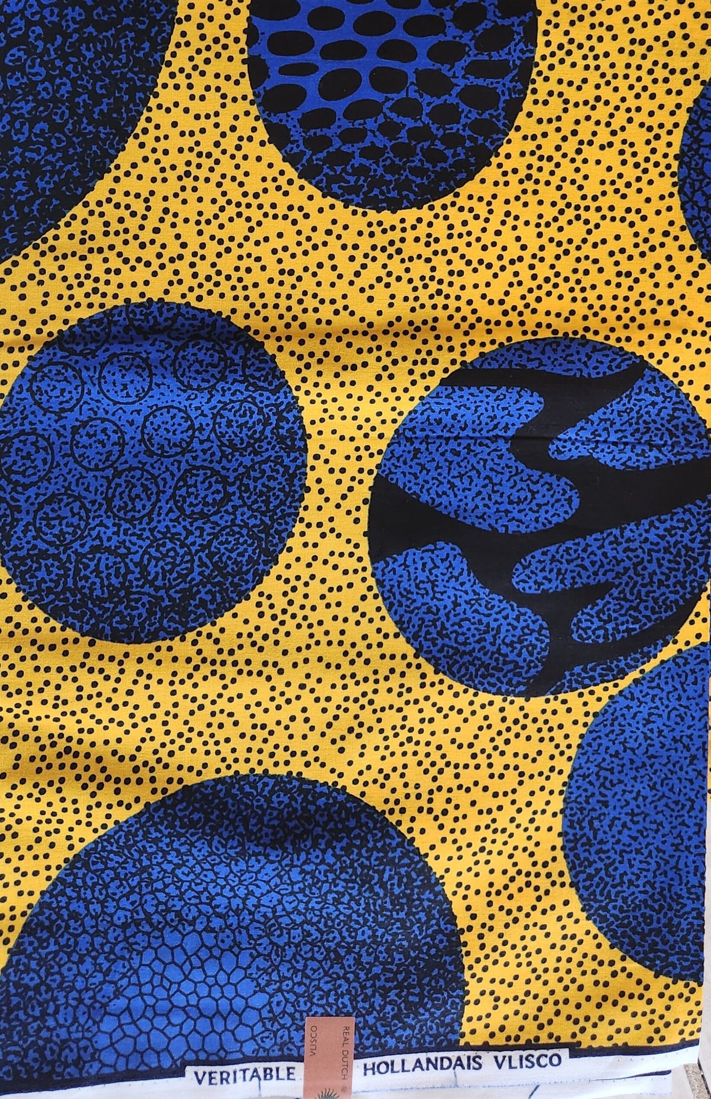 African Print Ankara featuring Multicolor Blue Polka dot in yellow . Sold by yard/6 Yards.
