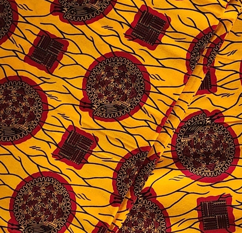 African Print Burgundy and Gold 100% Cotton/sold per yd or 6 yards.