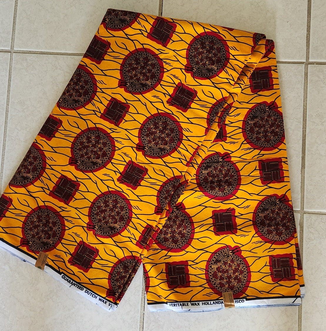 African Print Burgundy and Gold 100% Cotton/sold per yd or 6 yards.
