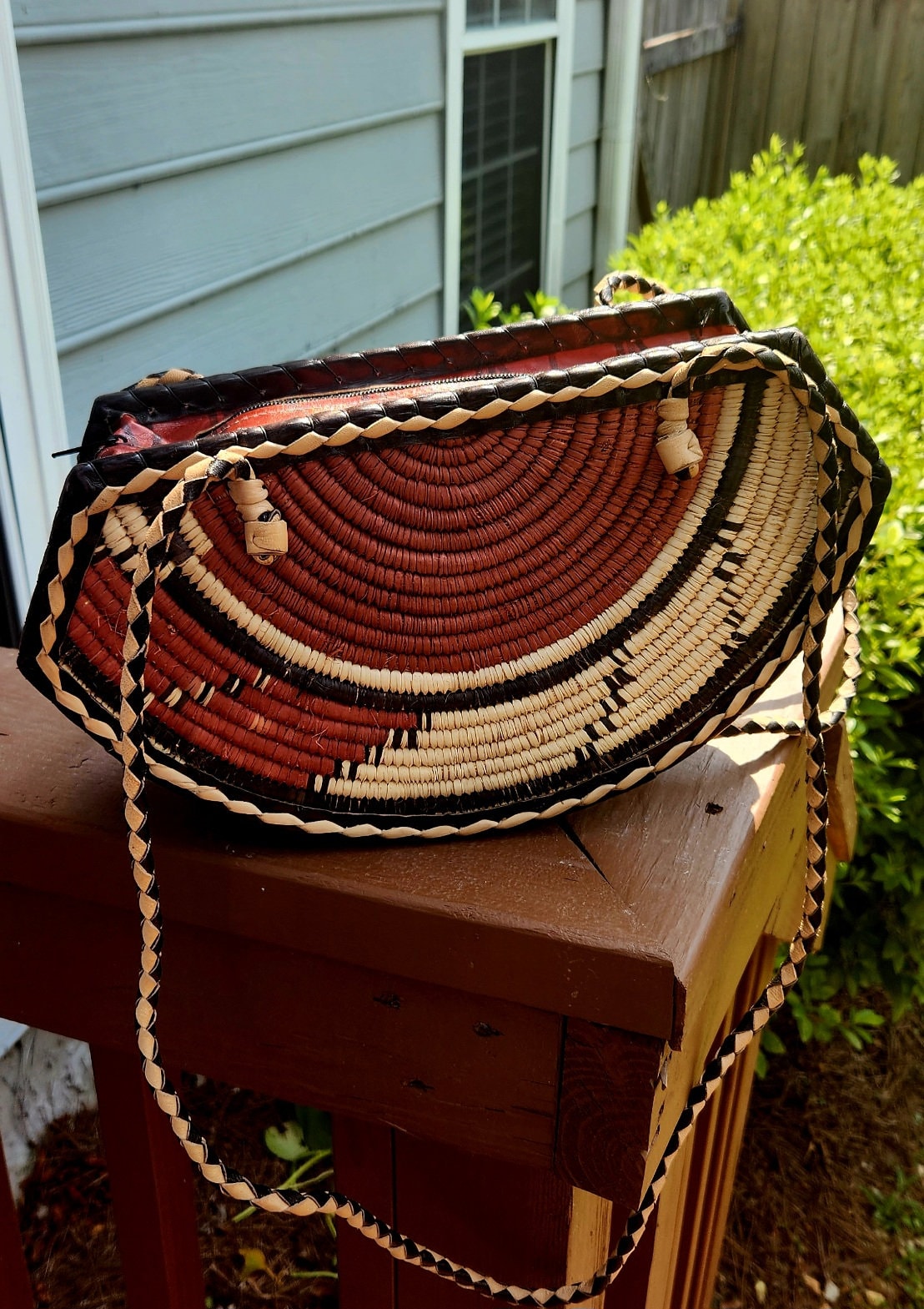 Small Round Bottom Burkina Rafia Purse/African Rafia Bag. Front Leather Art and Zipper Closure.