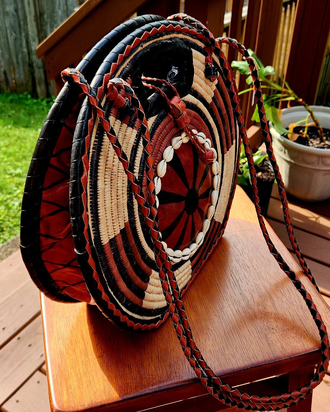 Burkina Flat Bottom Rafia Purse/African Rafia Bag/ Handcraftedin Burkina Faso. Front Leather Art and Zipper Closure with a handle.