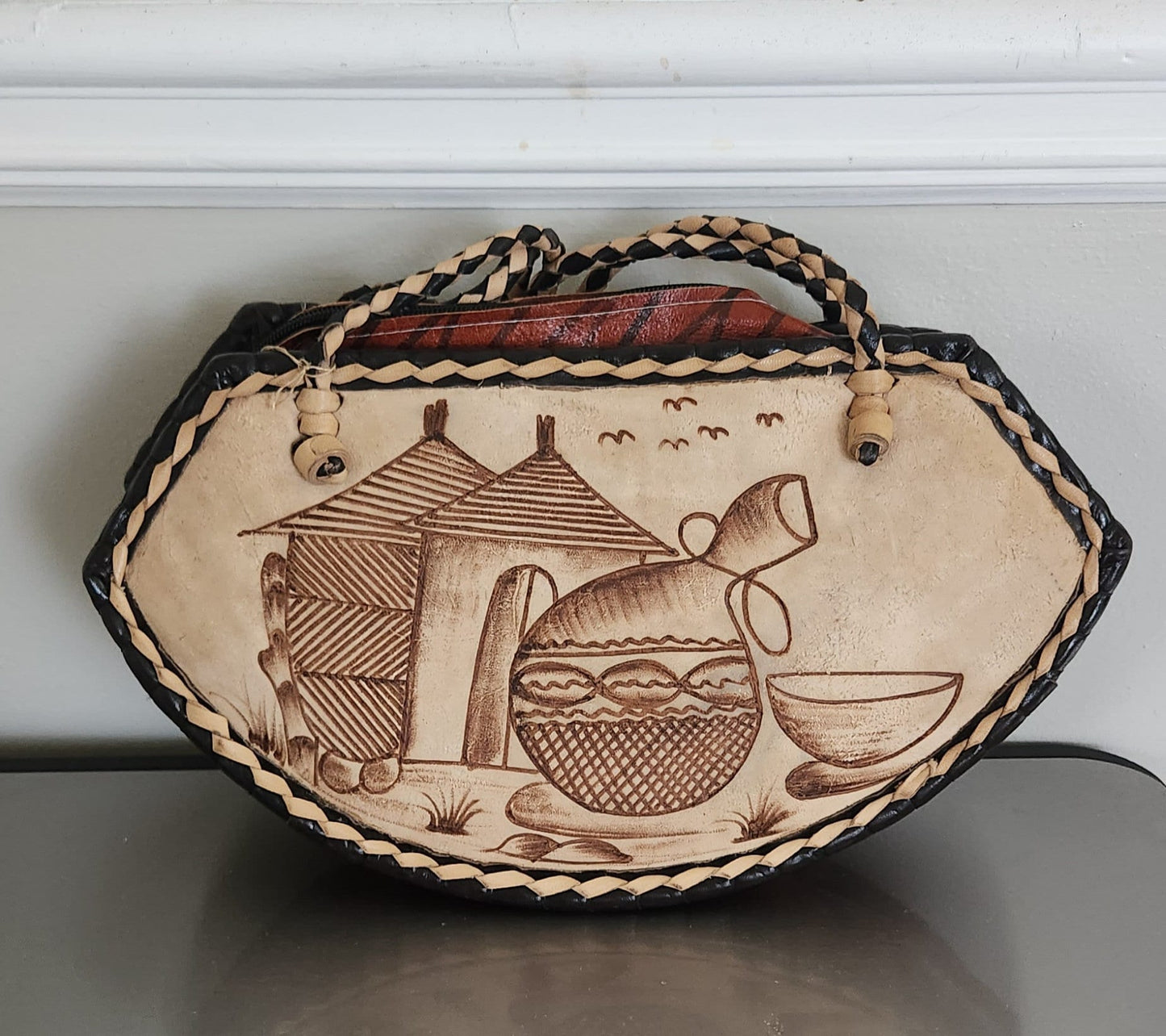 Small Round Bottom Burkina Rafia Purse/African Rafia Bag. Front Leather Art and Zipper Closure.