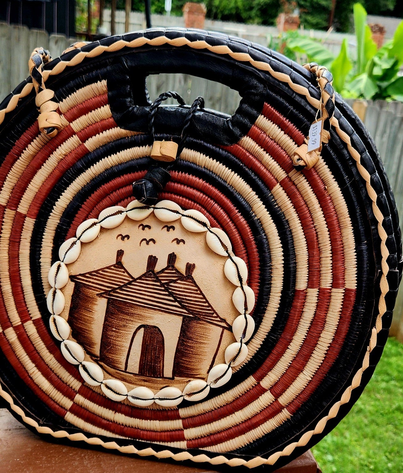 Burkina Flat Bottom Rafia Purse/African Rafia Bag/ Handcraftedin Burkina Faso. Front Leather Art and Zipper Closure with a handle.