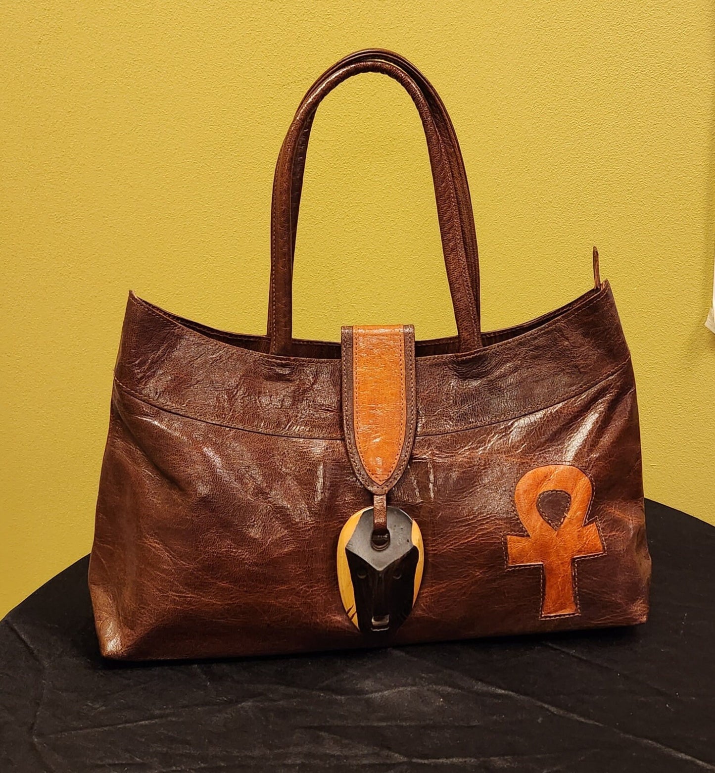 Exclusive African Leather Purse handcrafted with goat Leather and Ebony wood clasp.