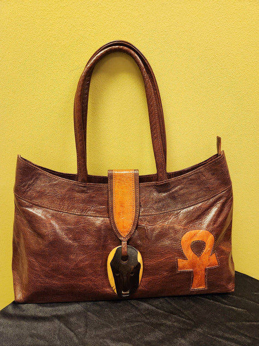Exclusive African Leather Purse handcrafted with goat Leather and Ebony wood clasp.